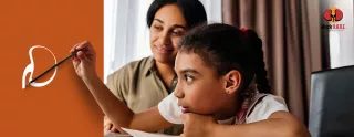 Image of a young girl holding a paintbrush while her mother looks on