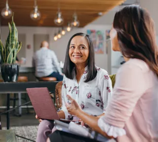 Friends working in coffee shop Friends working in coffee shop
